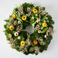 Straw Flower Wreath: Green privet leaves with yellow and white strawflowers and dried accents.