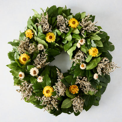 Straw Flower Wreath: Green privet leaves with yellow and white strawflowers and dried accents.