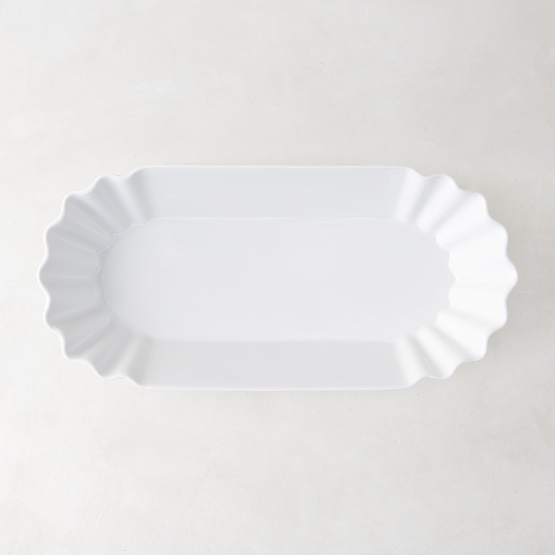 White Melamine Street Eats Hot Dog Holder, 9"L x 4"W, with scalloped edges.