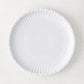 White 8.5" Melamine Street Eats Salad Plate with ribbed edge, mimicking a paper plate.