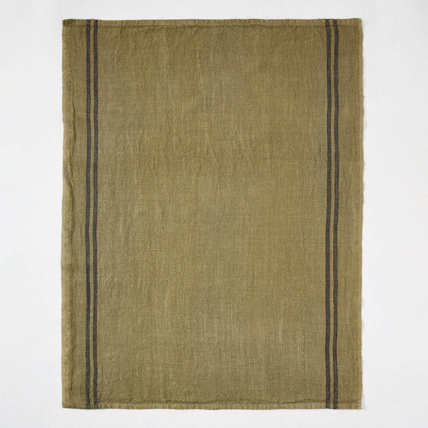 Deep green French linen hand towel with two black stripes along the left edge.