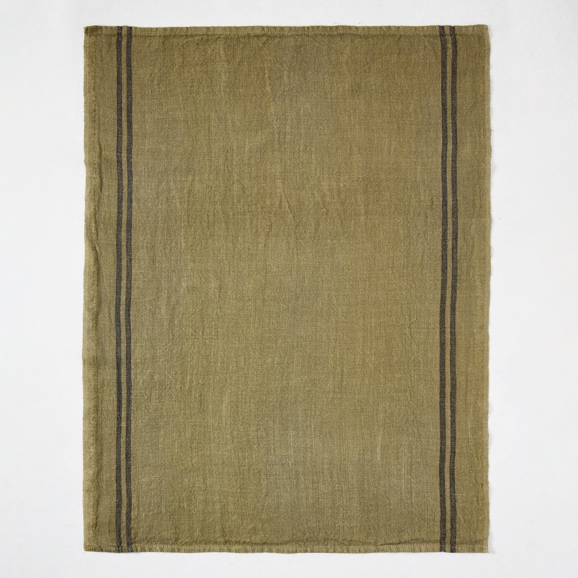 Deep green French linen hand towel with two black stripes along the left edge.