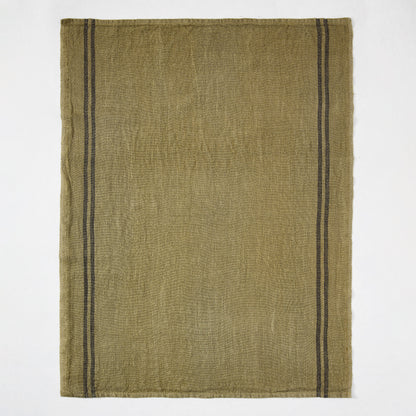 Deep green French linen hand towel with two black stripes along the left edge.