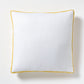 White linen square pillow with sun yellow velvet gusseted trim.