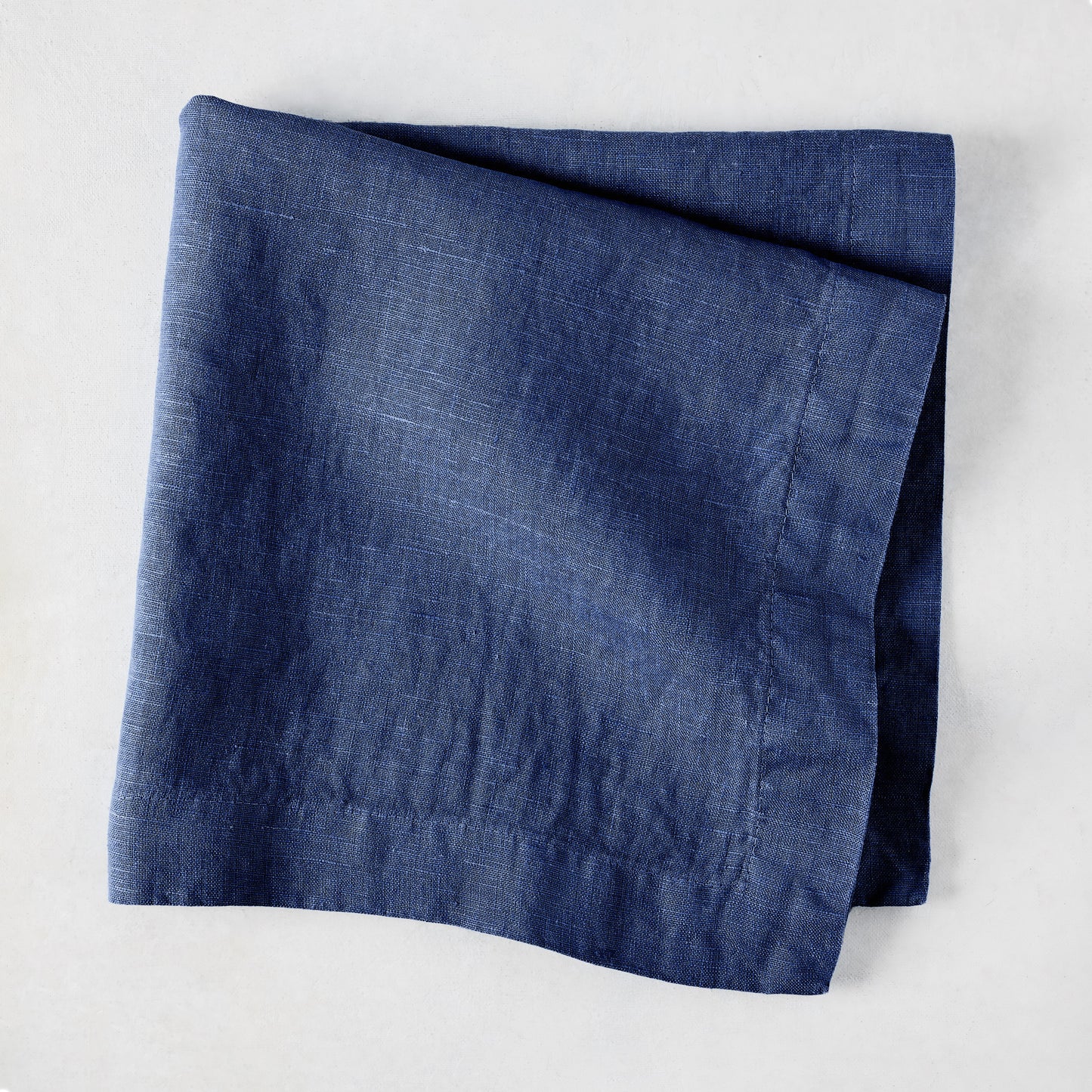 Surf Blue HG Signature Hand-dyed Linen Napkin, 22-inch square, folded.