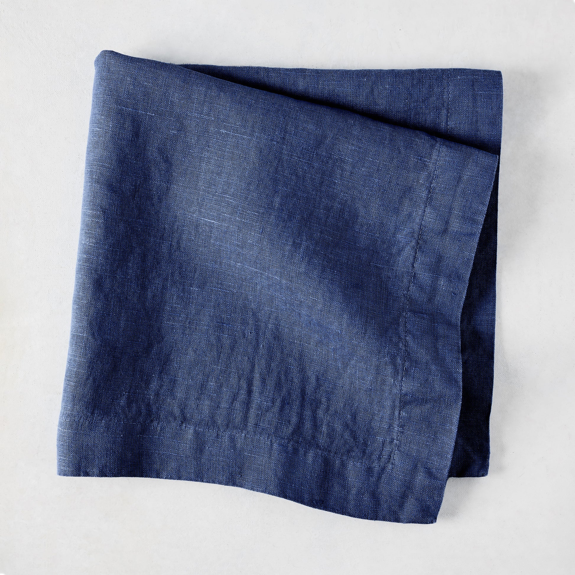 Surf Blue HG Signature Hand-dyed Linen Napkin, 22-inch square, folded.