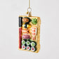 Hand-painted glass and resin sushi board Christmas ornament with glitter accents and red and black chopsticks.