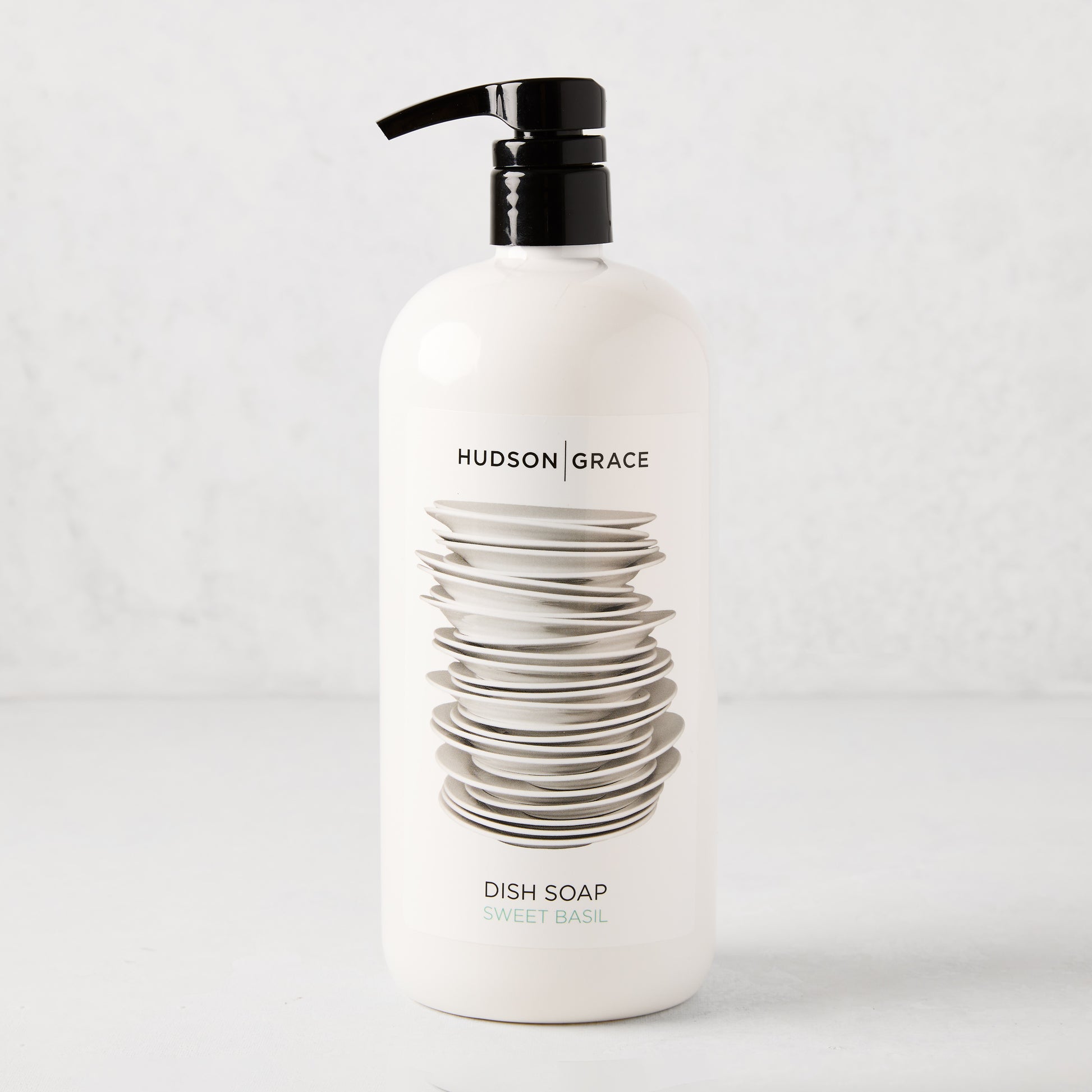 White HG Sweet Basil Dish Soap, 32 oz, with black pump and stacked dishes graphic.