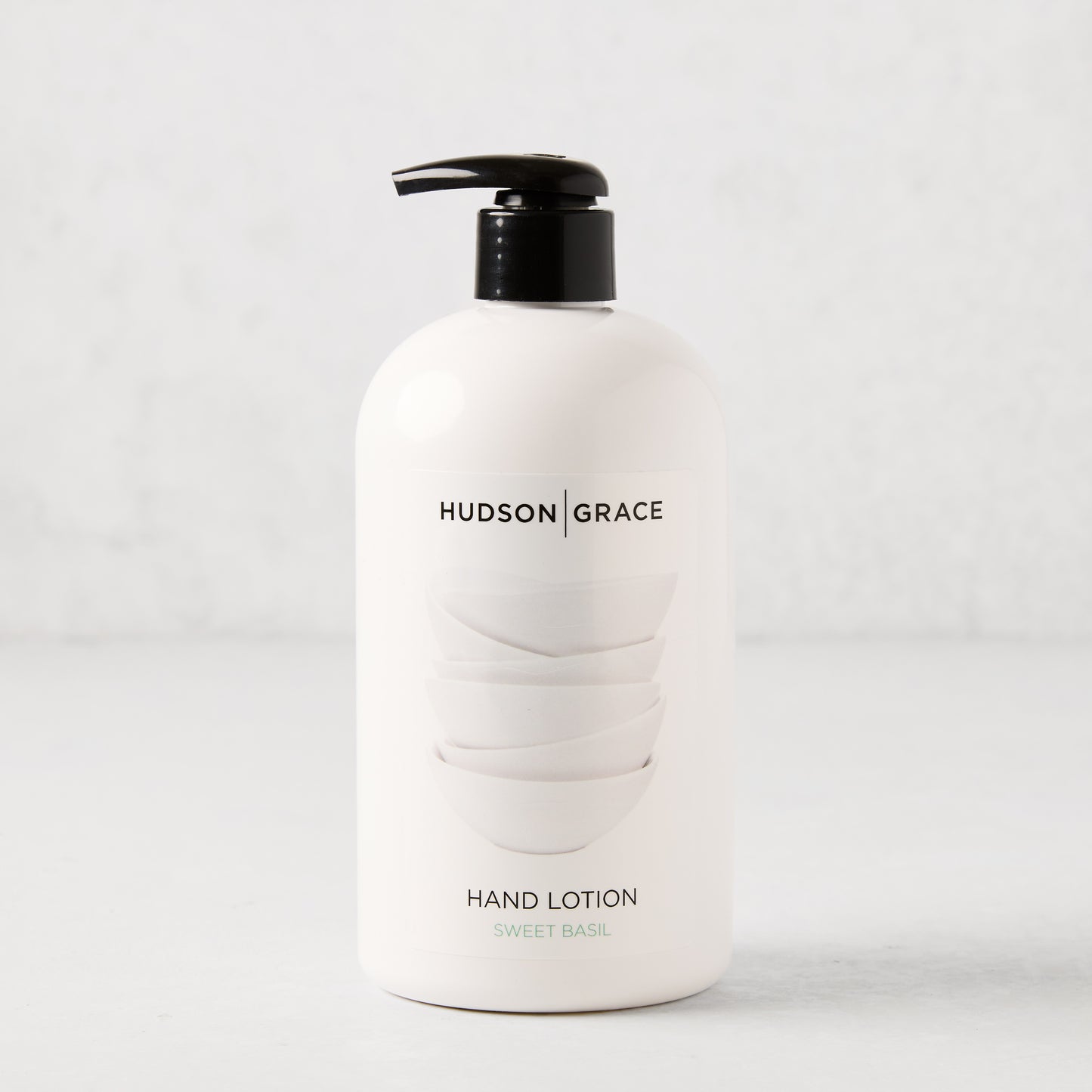 HG Sweet Basil Hand Lotion, 16 oz, in a white bottle with a black pump.