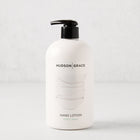 HG Sweet Basil Hand Lotion, 16 oz, in a white bottle with a black pump.