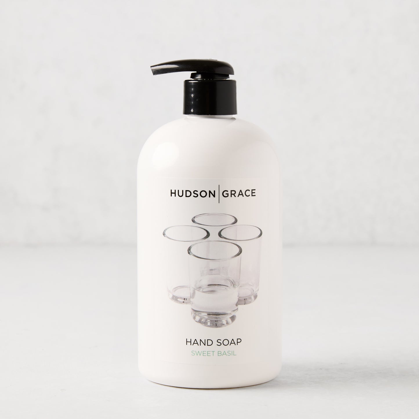 White HG Sweet Basil Hand Soap, 16 oz, with black pump and clear glass graphic.