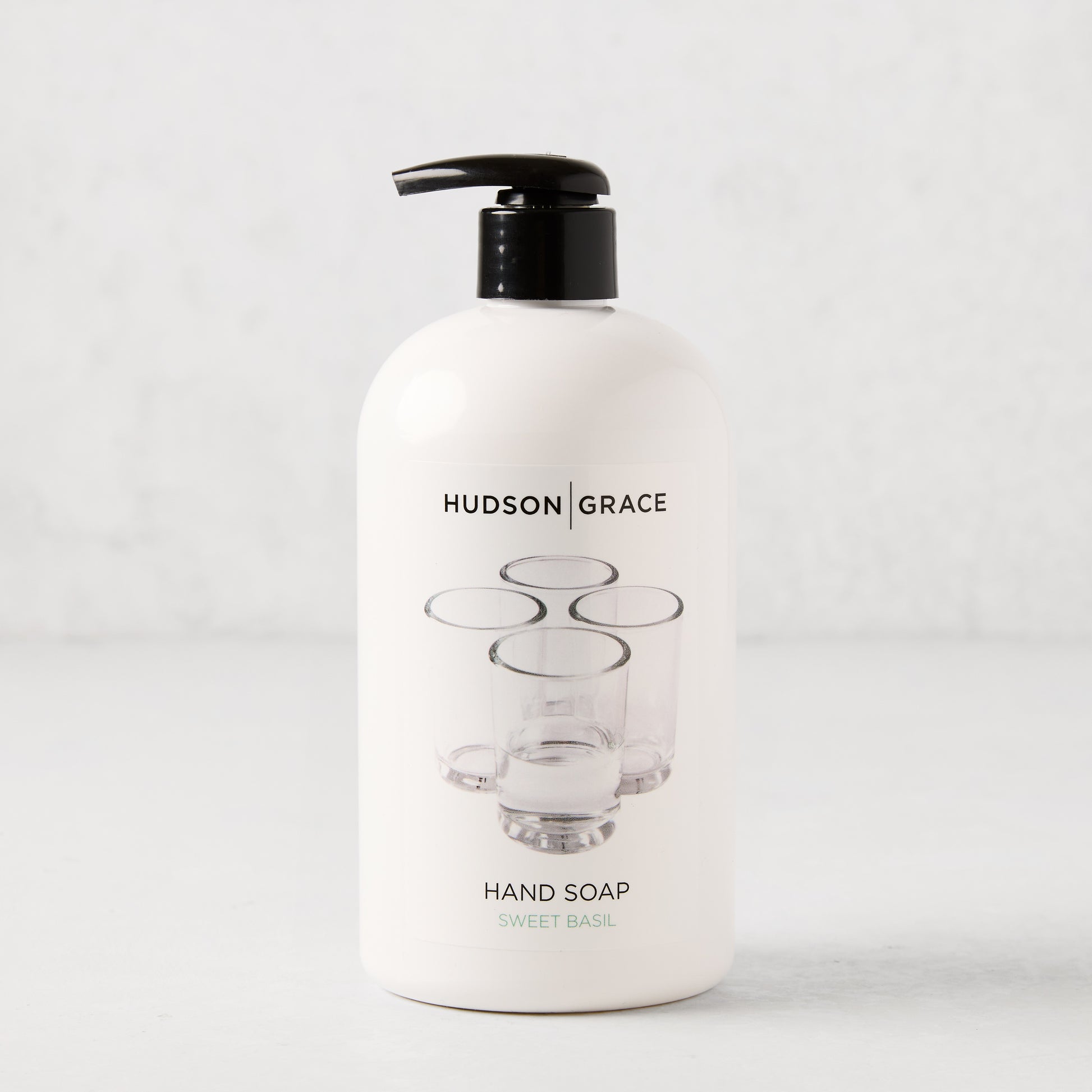 White HG Sweet Basil Hand Soap, 16 oz, with black pump and clear glass graphic.