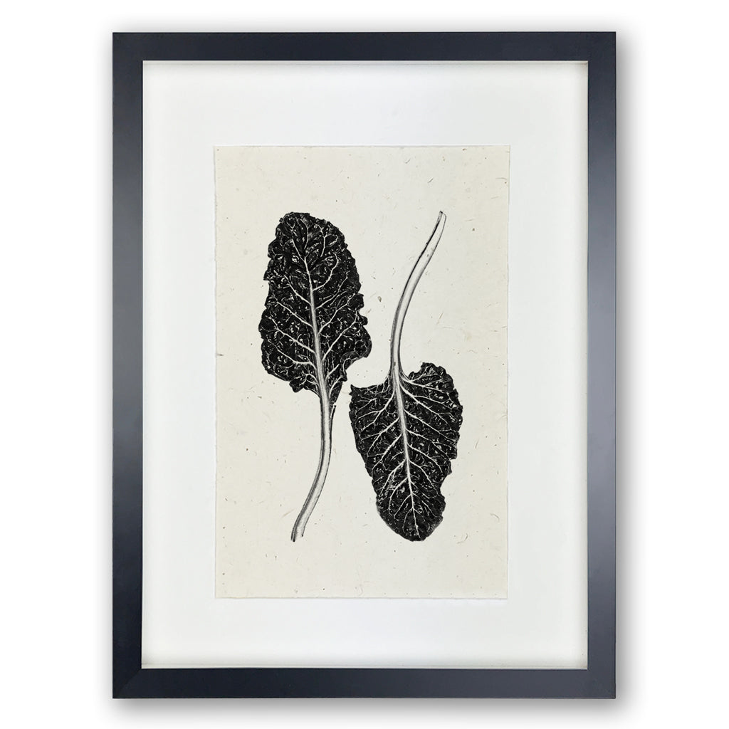 Black framed Swiss Chard handmade paper wall art print, featuring two dark leaves on light textured paper.