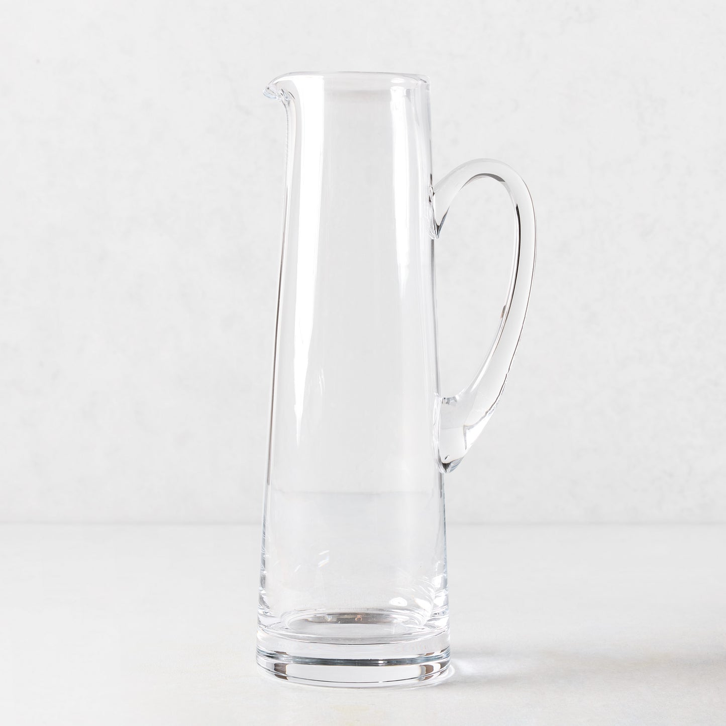 Tall, clear glass tapered bar pitcher with handle, 12.7"H, 57oz capacity.