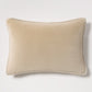 Tan reversible velvet and linen lumbar pillow, 20"L x 14"H, with visible linen piping.