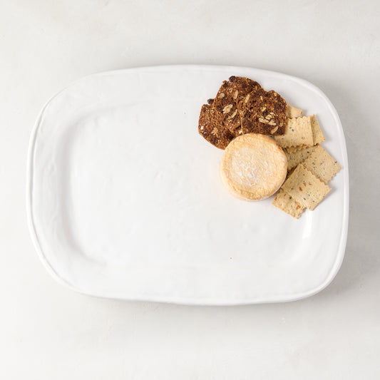 White Taormina ceramic rectangular serving platter, 15.7"L x 11.5"W, with crackers and cheese.