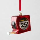 Red glitter glass tape measure Christmas ornament with "HANDY & CO. 25'" label.