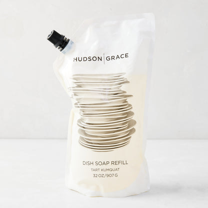 HG Tart Kumquat Dish Soap Refill Pouch, 32 oz, with stacked dishes graphic and black spout.