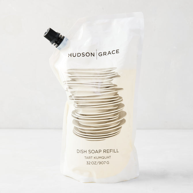 HG Tart Kumquat Dish Soap Refill Pouch, 32 oz, with stacked dishes graphic and black spout.