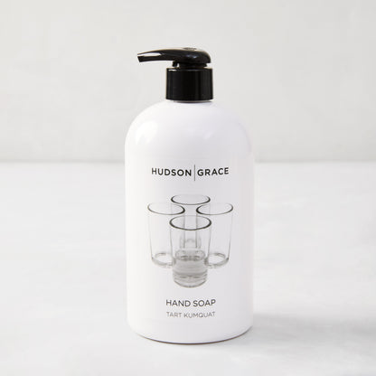 Hudson Grace Tart Kumquat Hand Soap, 16 oz, white bottle with black pump and glass graphic.