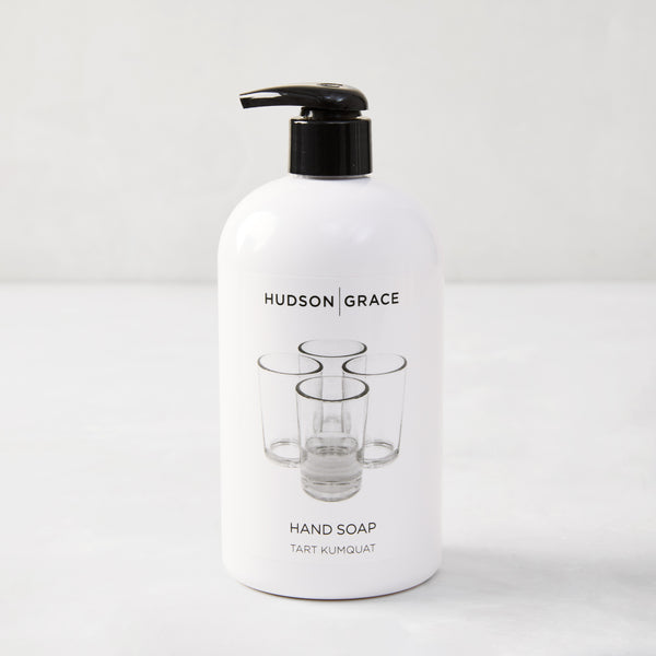 Hudson Grace Tart Kumquat Hand Soap, 16 oz, white bottle with black pump and glass graphic.