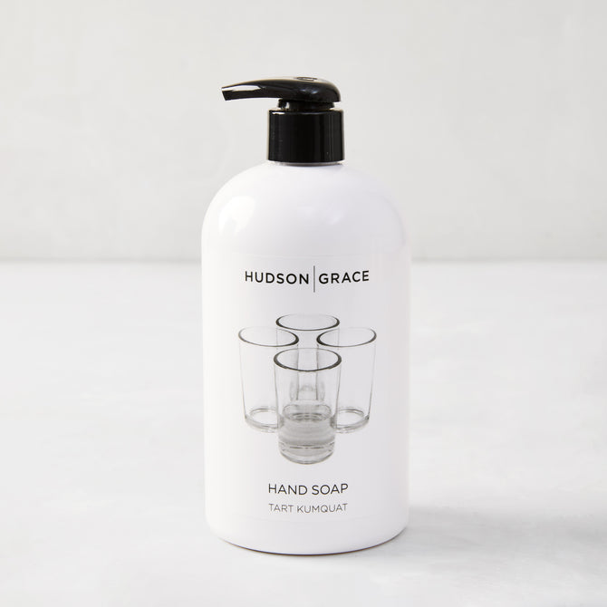 Hudson Grace Tart Kumquat Hand Soap, 16 oz, white bottle with black pump and glass graphic.