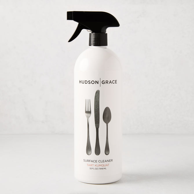 White HG Tart Kumquat Surface Cleaner spray bottle with black top and flatware graphic, 32 oz.