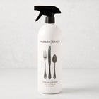 White HG Tart Kumquat Surface Cleaner spray bottle with black top and flatware graphic, 32 oz.