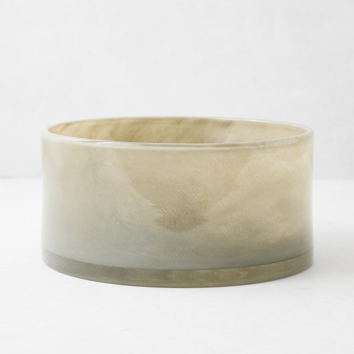 Hand-blown taupe glass cylinder decorative bowl with a smooth, modern finish, 9.8 inches in diameter.