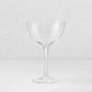 Clear glass Tavola martini coupe with a wide bowl and slender stem on a white background.