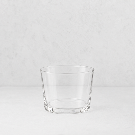 Clear glass Tavola mini tumbler with a simple, wide-rimmed design on a white surface.