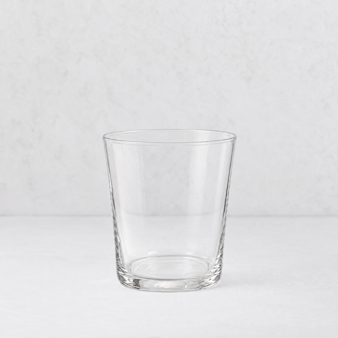 Medium Tavola tumbler made of clear, minimalist glass with a simple, tapered cylindrical design.