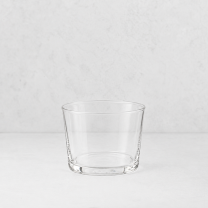 Clear glass Tavola mini tumbler with a simple, wide-rimmed design on a white surface.