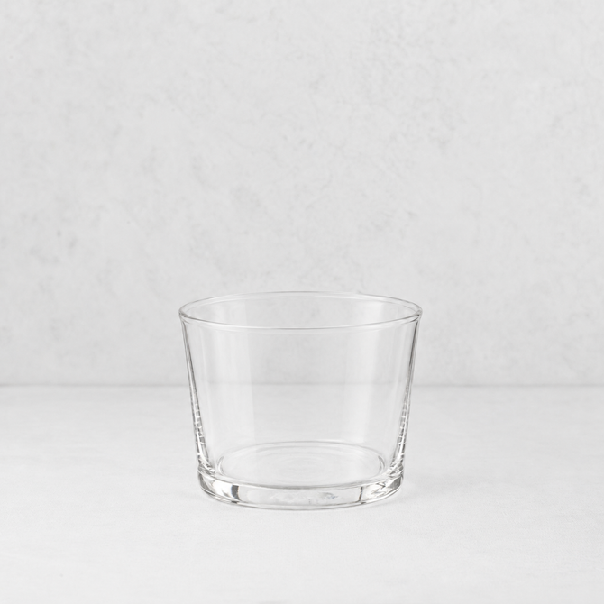 Clear glass Tavola mini tumbler with a simple, wide-rimmed design on a white surface.