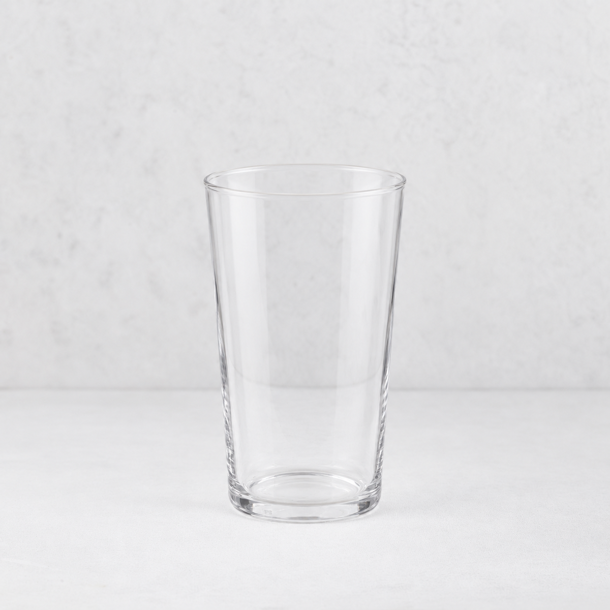 Tavola tall clear glass tumbler with a simple, minimalist cylindrical design on a light background.