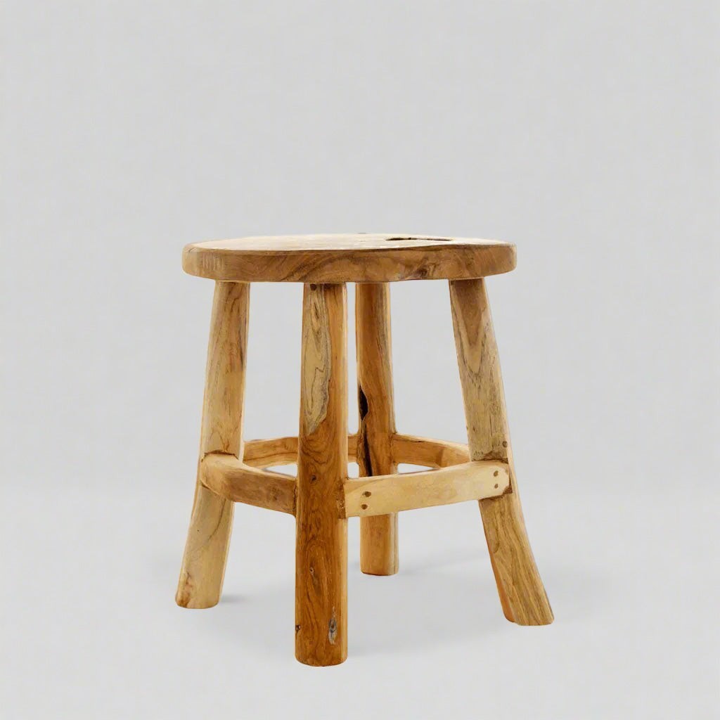 Handmade 17" reclaimed teak wood stool with natural grain and round seat.