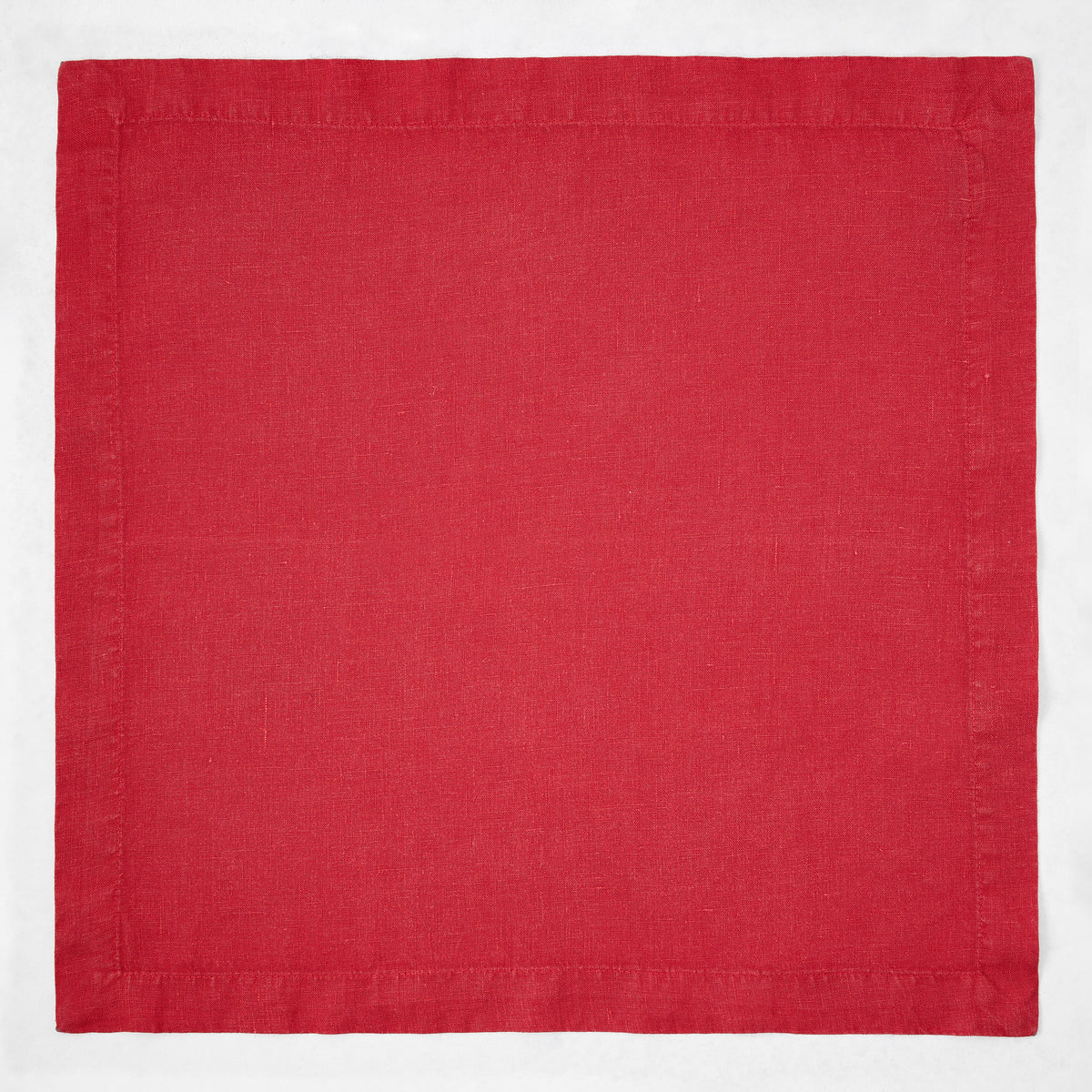 Flame red 22-inch square hand-dyed linen napkin with mitered corners.
