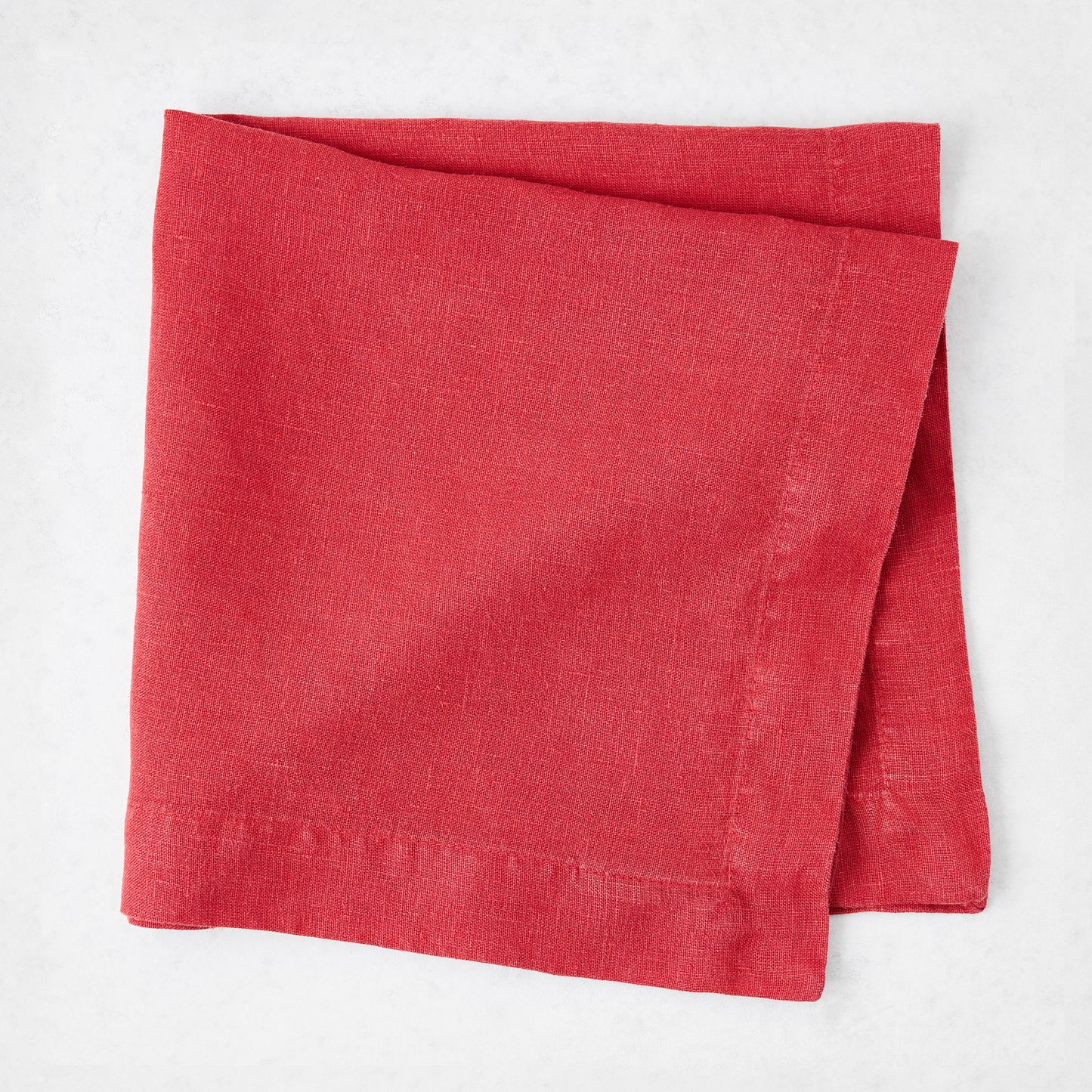 Tennis Shoe HG 22-inch square hand-dyed linen napkin in Flame red with mitered corners.