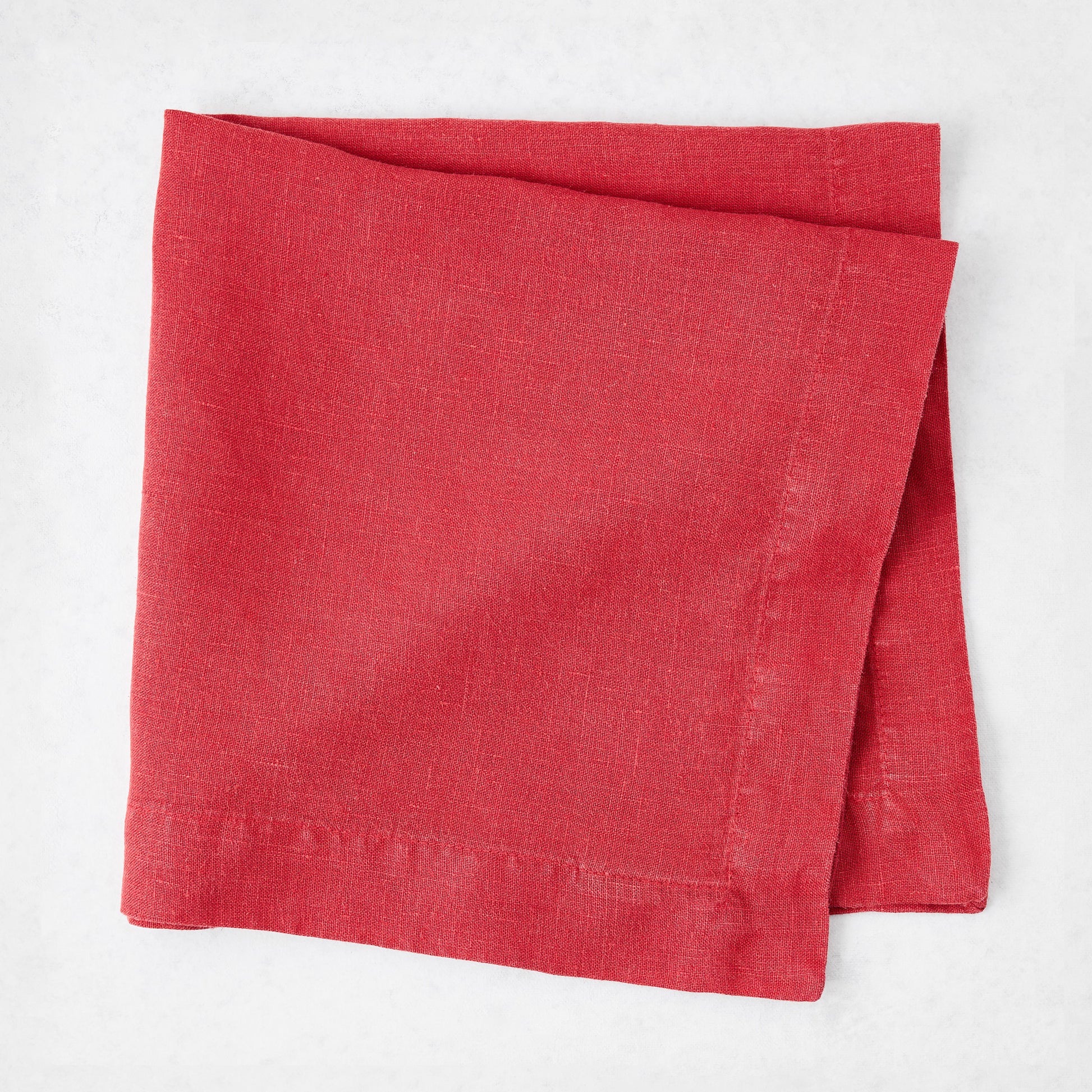 Tennis Shoe HG 22-inch square hand-dyed linen napkin in Flame red with mitered corners.