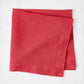 Tennis Shoe HG 22-inch square hand-dyed linen napkin in Flame red with mitered corners.