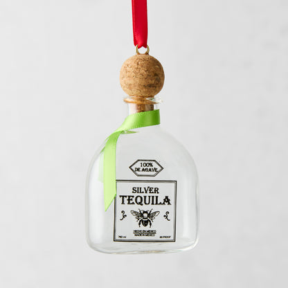 Glass tequila bottle Christmas ornament with cork top, red ribbon hanger, and green bow.