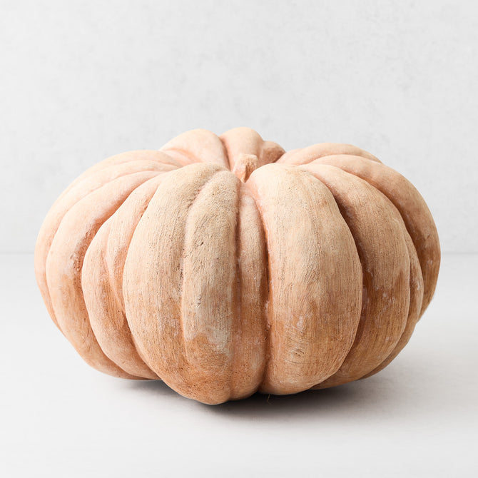 Large handcrafted terracotta pumpkin with a textured, matte finish in warm earthy tones, 12.5 inches wide.