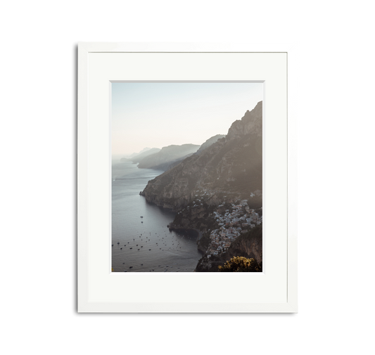 The Amalfi Framed Wall Art Print: picturesque Italian coast with white buildings, framed in white wood.