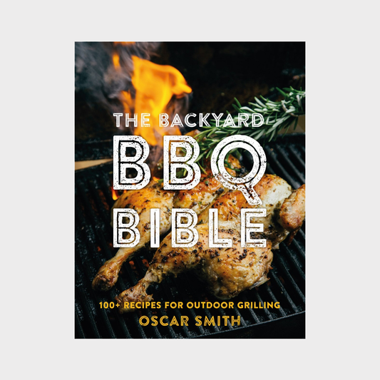 Hardcover cookbook "The Backyard BBQ Bible" with a grilled chicken and flames on the cover.