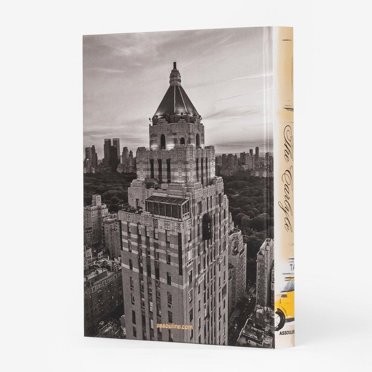 The Carlyle book, linen hardcover, features a black and white image of The Carlyle Hotel and a yellow taxi on the spine.