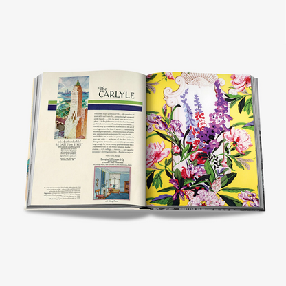 Open "The Carlyle" linen hardcover book with colorful floral endpapers and text.