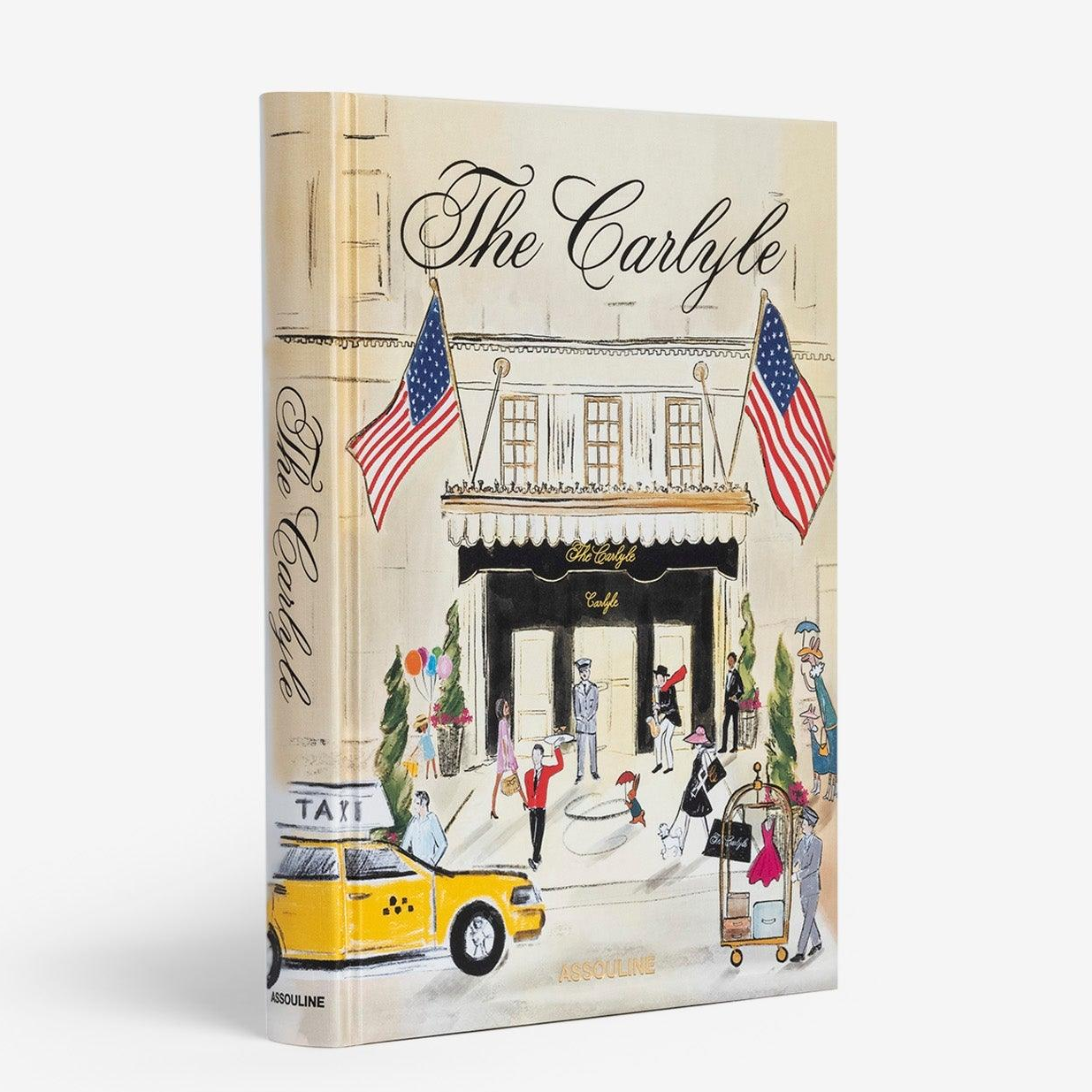 Linen hardcover book, "The Carlyle," with an illustrated cover of the hotel, a yellow taxi, and patrons.