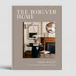 The Forever Home" coffee table book, beige hardcover with interior design image, by Mikel Welch.