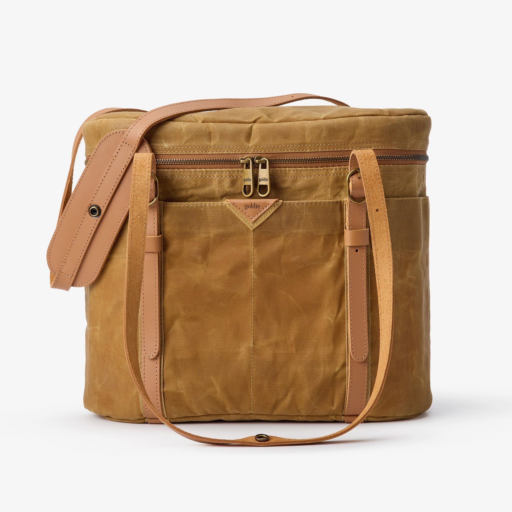 Goldie Picnic Bag: Tan waxed canvas insulated cooler with leather straps and gold zippers.