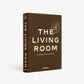 Brown hardcover book, "The Living Room" by Design Leadership Network, Assouline publisher.